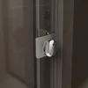 A close-up view of a shower door handle and frame. Produktbild-Vorschau