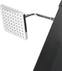 A close-up view of a modern square shower head attached to a curved arm, partially obscured by a black surface. Náhľad obrázku produktu