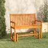A wooden garden bench sits on a grassy lawn in front of a textured wall. Náhled obrázku produktu