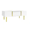 A white coffee table with gold accents and legs, shown against a white background. Produktbild-Vorschau