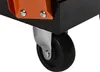 A close-up view of a black and orange tool cart's wheel and mounting bracket. Produktbild-Vorschau