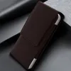 A brown leather phone case with a silver accent is shown from a diagonal angle. Náhled obrázku produktu