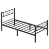 A black metal twin-size bed frame with a decorative headboard and footboard, shown from a diagonal angle against a white background. Náhled obrázku produktu