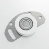 A close-up studio shot of a roller bearing assembly with a gray metal bracket. Produktbild-Vorschau