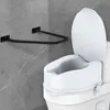 A white toilet seat riser is installed on a toilet, next to a gray tiled wall with a black U-shaped grab bar mounted on it. Anteprima dell’immagine prodotto