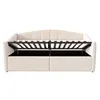 A beige upholstered bed frame with the mattress support mechanism open, revealing storage compartments underneath. Produktbild-Vorschau