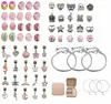 A collection of jewelry making supplies, including beads, charms, and bracelets, arranged on a white background. Produktbild-Vorschau