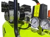 Close-up view of an air compressor's motor, gauges, and control panel. Produktbild-Vorschau