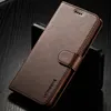 A brown leather flip case for a smartphone is shown on a dark, textured surface. Produktbild-Vorschau
