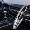 A handheld vacuum cleaner is placed inside a car's interior. Produktbild-Vorschau