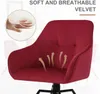 A close-up marketing image of a red velvet chair with text overlays highlighting its features. Produktbild-Vorschau