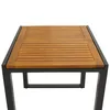 A close-up view of a wooden slatted tabletop with a dark metal frame, isolated on a white background. Produktbild-Vorschau