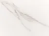A close-up of a white surface with gray marble-like veining. Produktbild-Vorschau