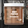 A product shot of a protein powder tub in a gym setting. Produktbild-Vorschau