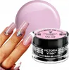 A hand with manicured nails is shown next to a jar of pink nail gel and a large pink sphere. Anteprima dell’immagine prodotto