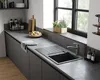 A modern kitchen sink area with a faucet, countertop, and cabinets. Produktbild-Vorschau