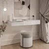 A modern vanity table with a stool in a well-lit room. Produktbild-Vorschau