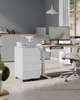 An office desk setup with a computer, printer, and filing cabinet. Anteprima dell’immagine prodotto