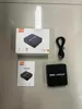 A flat lay of an ezcap181P AV-Recorder, its packaging, and a manual. Náhled obrázku produktu