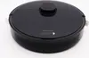 A black robot vacuum cleaner is shown from a slightly elevated front-diagonal angle against a white background. Náhled obrázku produktu
