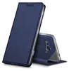 A blue flip case for a smartphone is shown standing upright, with the phone partially visible inside. Náhled obrázku produktu