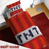 A Minecraft-themed duvet cover and pillow set designed to look like TNT blocks, laid out on a bed in a bedroom setting. Podgląd zdjęcia produktu