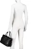 A black quilted handbag is displayed on a white mannequin. Náhľad obrázku produktu