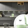 A modern kitchen setting with a mint-colored kettle. Produktbild-Vorschau