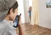 Two children playing with walkie-talkies in a room. Produktbild-Vorschau