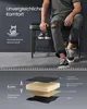 A person sitting on a shoe bench with a diagram showing the layers of the bench cushion. Produktbild-Vorschau