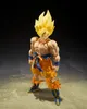 A Dragon Ball Z Super Saiyan Son Goku action figure standing on a textured surface with a dark background. Produktbild-Vorschau