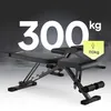 A black weight bench is shown in front of a dark, smoky background with large white text indicating weight capacity. Produktbild-Vorschau