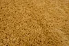 A close-up, textured view of a yellow rug. Anteprima dell’immagine prodotto