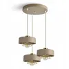 A multi-pendant light fixture hanging from a ceiling. Produktbild-Vorschau