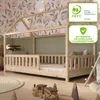 A child's bedroom with a wooden house bed, toys, and decorative wallpaper. Produktbild-Vorschau