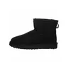 A single black Ugg boot shown from the side against a white background. Voir les images du produit