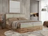 A bedroom scene featuring a large boxspring bed. Produktbild-Vorschau