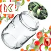 A collection of fresh vegetables and a glass jar, with a stylized 'K' logo. Podgląd zdjęcia produktu