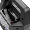 A close-up view of the interior of a black battery charger, showing a black power cord plugged into a compartment. Produktbild-Vorschau