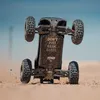 An RC car is shown upside down, kicking up dust on a sandy surface with a blue sky in the background. Náhľad obrázku produktu