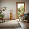 A cozy living room scene with a wooden decorative column, a chair, plants, and a window overlooking a garden. Anteprima dell’immagine prodotto