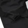 A close-up view of a black fabric pocket with a velcro closure on outdoor pants. Produktbild-Vorschau