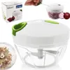 A product shot of a manual food chopper, with packaging and a close-up of chopped ingredients. Náhled obrázku produktu