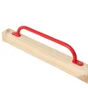 A red climbing handle attached to a wooden beam. Náhľad obrázku produktu