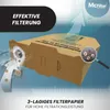 A cardboard vacuum cleaner bag is shown with a magnifying glass highlighting dust particles and a graphic illustrating effective filtration. Produktbild-Vorschau
