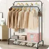 A metal garment rack with clothes and accessories displayed. Anteprima dell’immagine prodotto