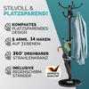 A coat rack with a marble base and a jacket, umbrella, and cap on it, with promotional text and a quality seal. Anteprima dell’immagine prodotto