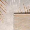 A close-up view of a rug with a leaf pattern. Anteprima dell’immagine prodotto