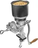 A manual grain mill with a hopper filled with grain, clamped to a surface. Produktbild-Vorschau