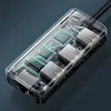 A close-up, transparent view of a USB hub showing its internal circuitry and ports. Voir les images du produit